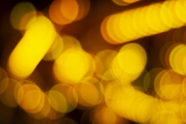 クリスマス休暇抽象的なテクスチャライト黄色のボケの背景 - 写真・画像