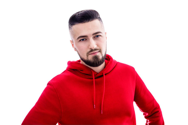 Handsome man in red casual clothes posing on white background - Photo, Image