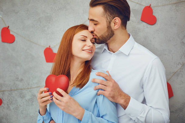 A loving couple with hearts . Valentines Day. - Zdjęcie, obraz