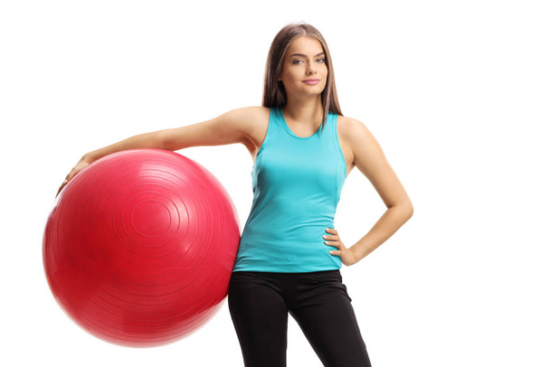 Beautiful young woman with a pilates ball - Photo, image
