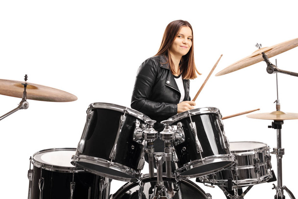 Young female musician playing a drum set - Fotoğraf, Görsel