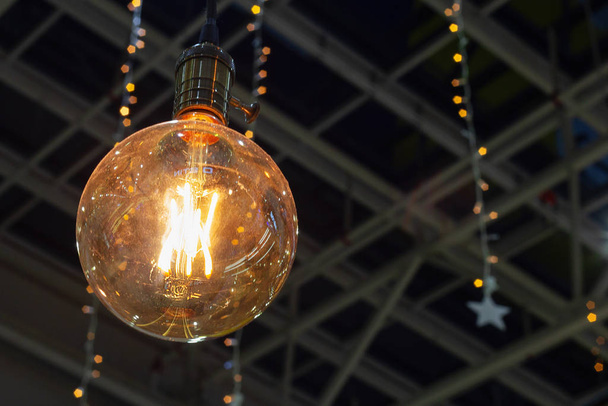 light bulb with thread filament festive illuminations vintage - Foto, Imagem