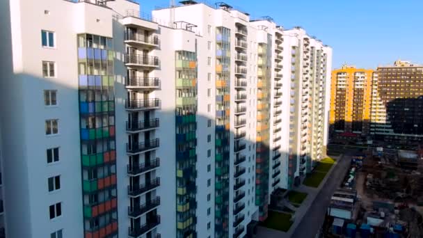 Blocks of newly built houses capable of accommodating thousands of residents, multi storey housing. Motion. Subdivision development of tightly packed homes with driveways, vast neighborhood suburbia. - Footage, Video