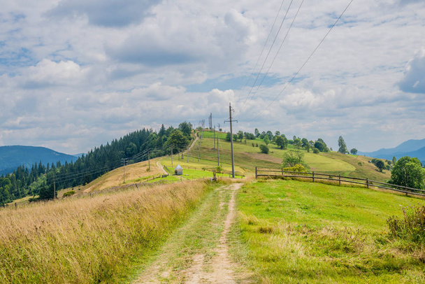 Summer landscape in mountains and the dark blue sky with clouds. - Fotó, kép