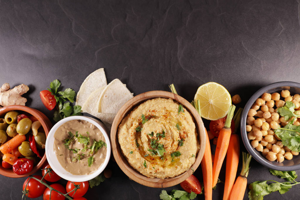 hummus, dipping sauce and vegetable, bread pita- lebanese food - Foto, immagini