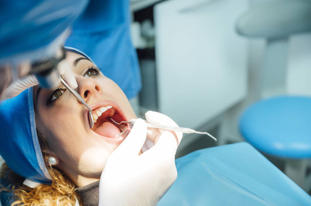 Dentist examining a patient - Photo, Image