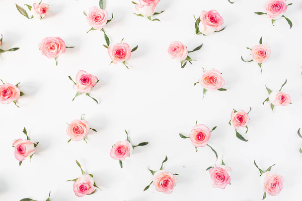 Round frame border of pink rose flower buds on white background. Mockup blank copy space. Flat lay, top view floral composition. - Fotografie, Obrázek