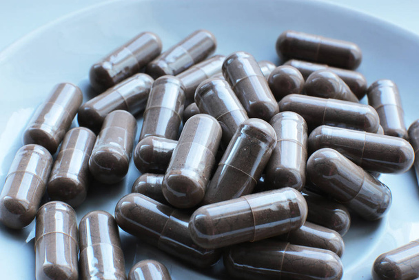  macro sfondo pillole lisce, integratori biologici medici e vitamine sane
 - Foto, immagini