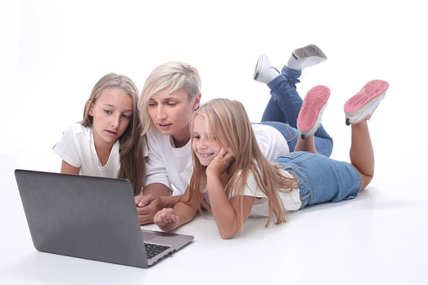 mom and daughters watching their favorite video on a laptop - Foto, immagini