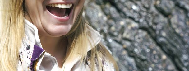 Close up of caucasian woman with white teeth smiling. blond female scream outdoor. close up image.  - Φωτογραφία, εικόνα