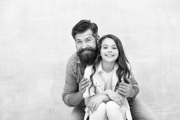 Strengthening father daughter relationships. Family hug. Father and daughter hug light background. Friendly relations. Fathers day concept. Lovely father and cute kid. Child and dad best friends - Foto, Imagem