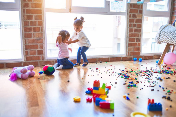 Adorable toddlers playing at kindergarten - Photo, image