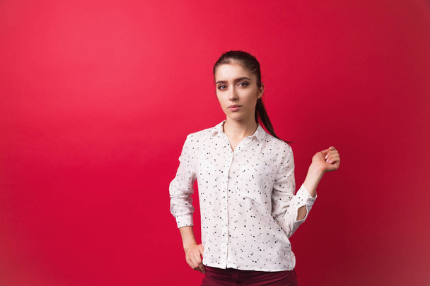 Studio portrait of  smart girl student on red background . school girl  - Fotografie, Obrázek
