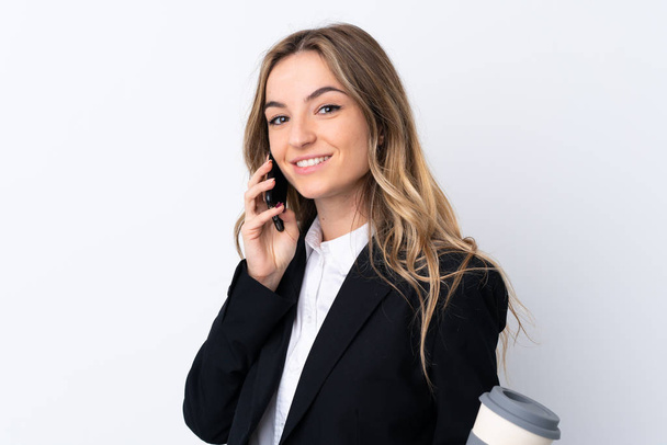 Young business woman over isolated white background holding a cu - Zdjęcie, obraz