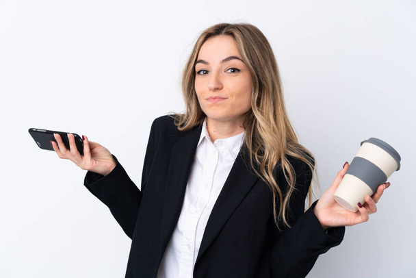 Young business woman over isolated white background holding a cu - Φωτογραφία, εικόνα