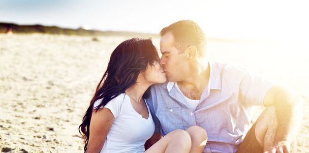 Romantic couple kissing on the beach. - Photo, Image