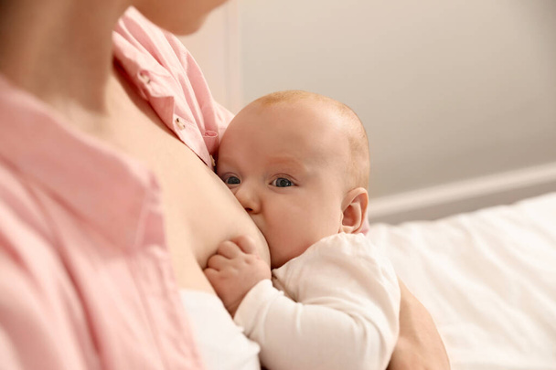 Young woman breast feeding her little baby, closeup - Fotó, kép