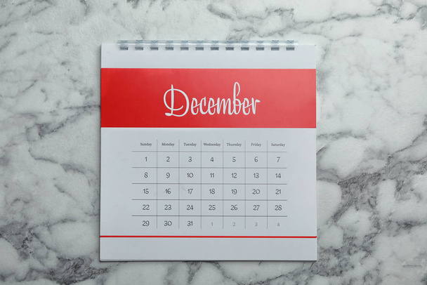 December calendar on marble background, top view - Foto, Imagem