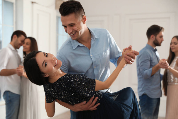 Lovely young couple dancing together at party - Photo, Image