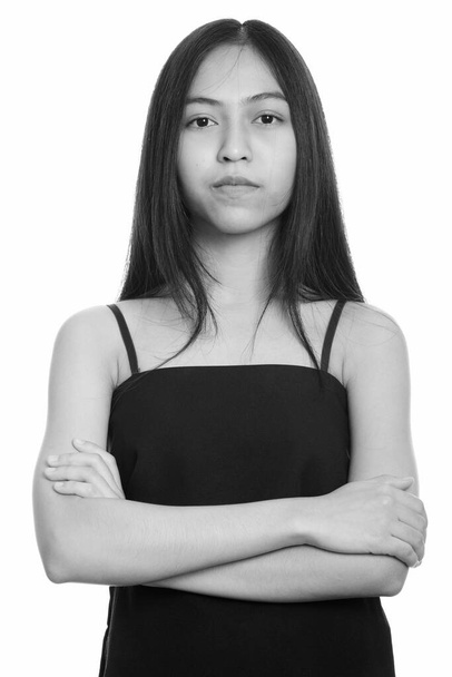 Close up of young Asian teenage girl with arms crossed - Foto, immagini