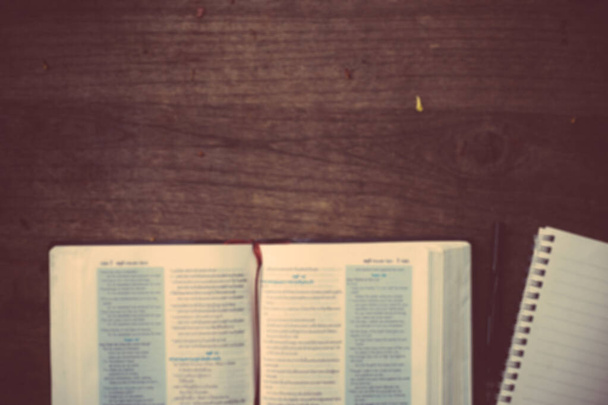 Soft focus The holy bible on wood table with copy space.christian background - 写真・画像