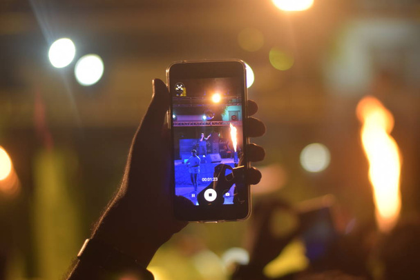 hand holding smartphone and recording video during concert - Photo, Image