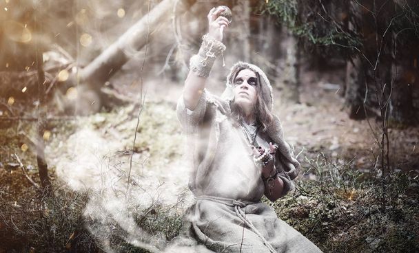 Fairy magician. A sorcerer with a glass sphere, a magical spell  - Fotografie, Obrázek