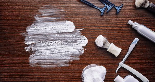 Shaving accessories on a wooden texture background. Tools. Dispo - 写真・画像