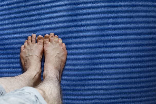 Mat for practicing yoga on the floor. Healthy lifestyle. - 写真・画像