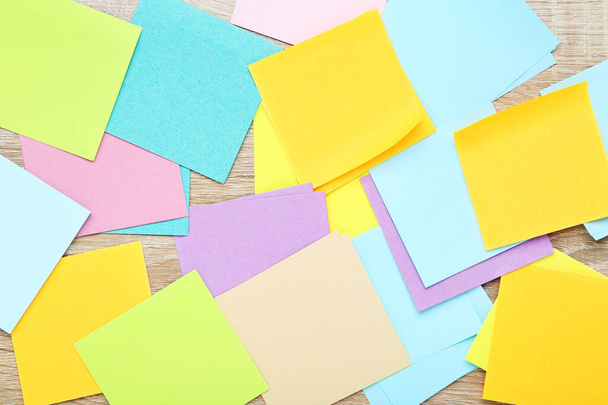 Colorful paper sticky notes on wooden table - Foto, Bild