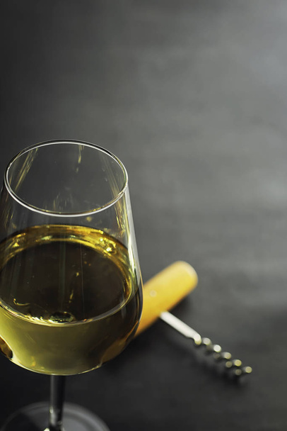 Transparent bottle of white dry wine on the table. White wine gl - Foto, Bild