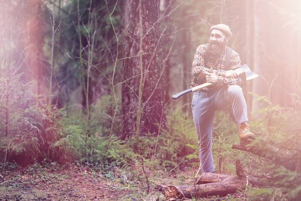 A bearded lumberjack with a large ax  - Photo, Image