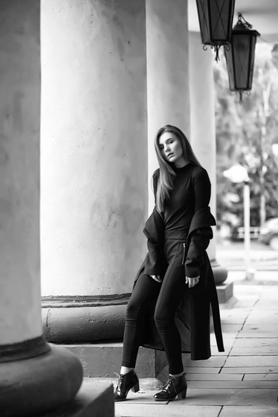 Girl in a coat black and white photo - Фото, зображення