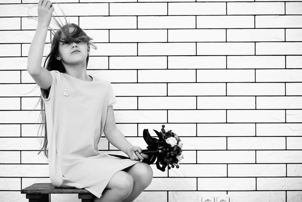 little girl on a chair black and white - Valokuva, kuva