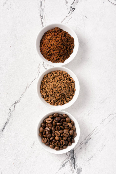 Roasted beans and ground coffee for morning espresso - Φωτογραφία, εικόνα