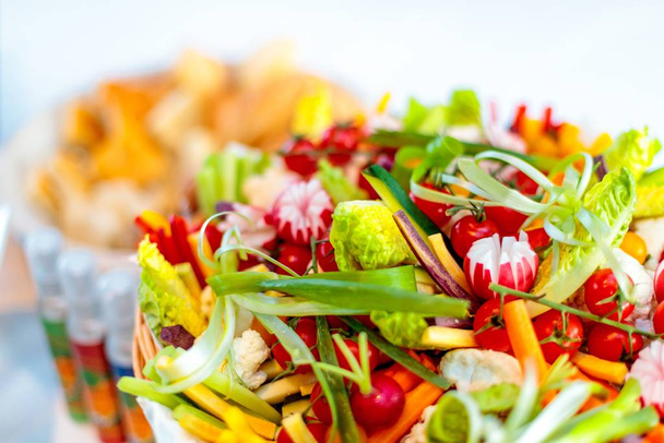 Closeup shot of salad with different vegetables with a blurred background - Foto, Imagem