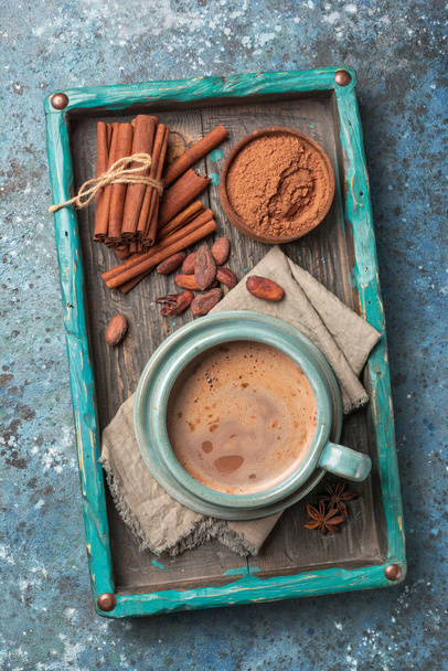 Tasty cocoa drink with spices in big cozy cup - Zdjęcie, obraz