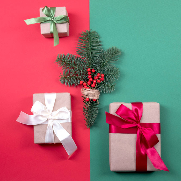 Beautiful packaging of presents with satin ribbons and pine branch. - Foto, imagen