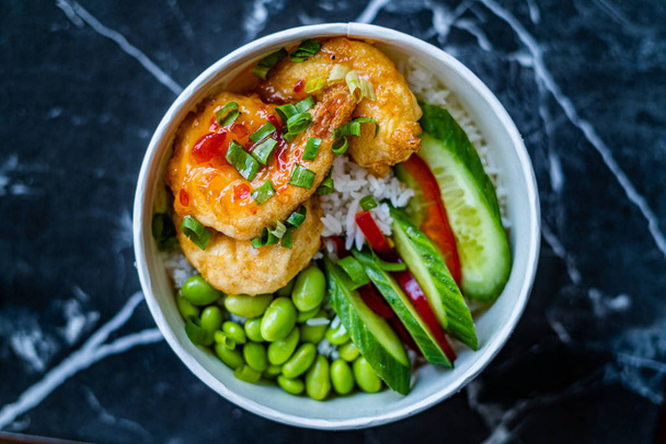 Take Away Healthy Buddha Bowl with Shrimp, Edamame Beans, Cucumber and Basmati Rice / Poke Bowl in Plastic Box Package or Container.  - Zdjęcie, obraz