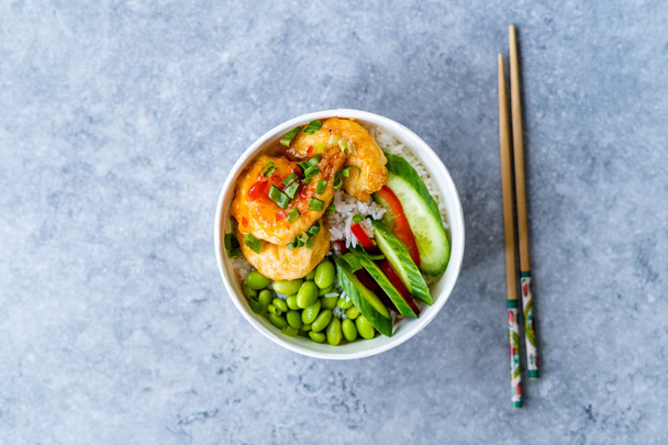 Take Away Healthy Buddha Bowl with Shrimp, Edamame Beans, Cucumber and Basmati Rice / Poke Bowl in Plastic Box Package or Container.  - Zdjęcie, obraz