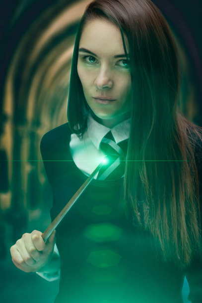 The girl wizard with a magic wand. dark magic, - Photo, image
