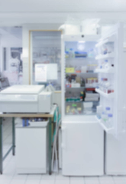 Scientific background: modern laboratory interior out of focus with open fridge, text space  - Foto, Bild