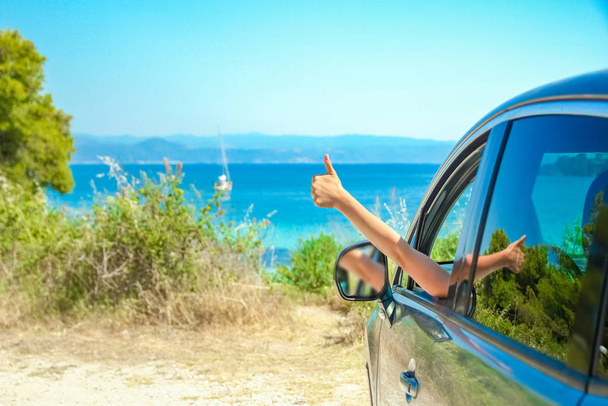 happy girl from car at sea greece background - Photo, Image