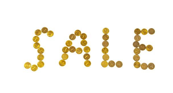 Sale sign, lined with 10-ruble coins (written ten rubles, the Bank of Russia in the Russian) on white background  - Zdjęcie, obraz