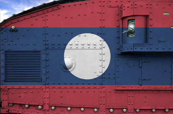 Laos flag depicted on side part of military armored tank close up. Army forces conceptual background - Photo, Image