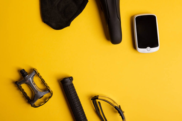 Bicycle, Cycling accessories on the yellow background. view from - 写真・画像