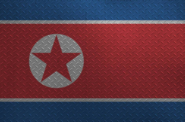 Észak-Korea zászló festett színekben régi ecset fém lemez vagy fal közeli. Texturált banner durva háttér - Fotó, kép
