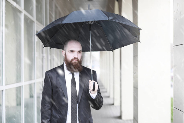 A bald bearded man in a suit - Zdjęcie, obraz