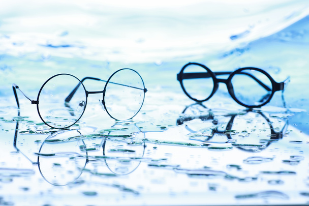 Tools for vision correction. Glasses and lenses with diopters on - Photo, Image