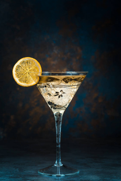 Mojito cocktail in martini glass on black background - Foto, imagen